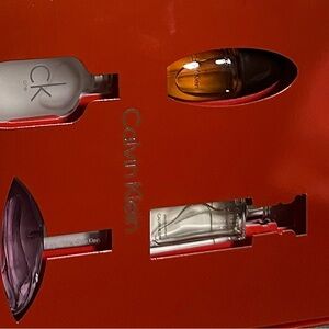 Calvin Klein Fragrance Collection with Gray, Gold, Purple, and Clear Bottles